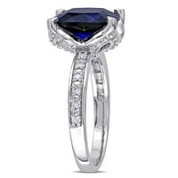 Tangelo 2-karat T. G. W. stvorio je zaručnički prsten od plavog safira i dijamantskog akcenta od 10k bijelog